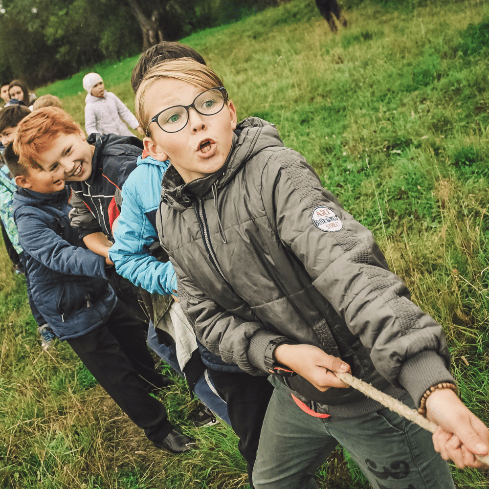 kids perspiring in tug of war