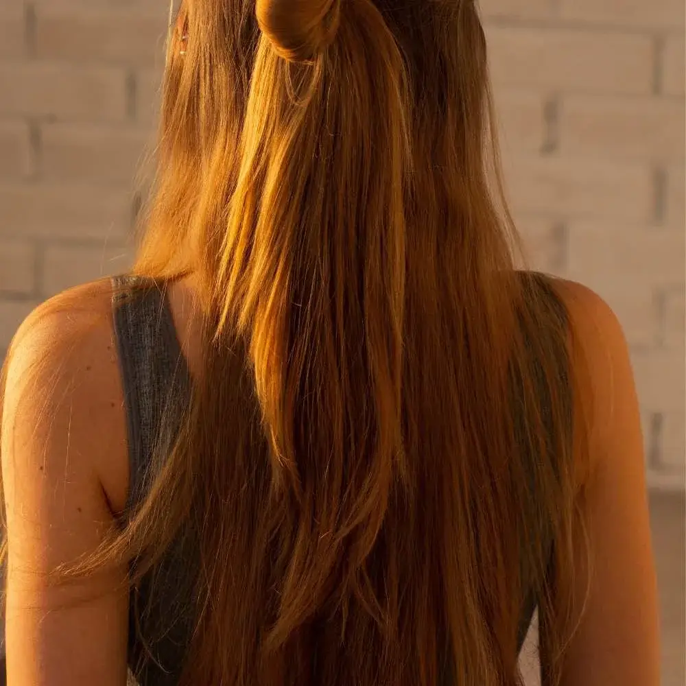 Model showcasing shiny, healthy hair extensions after using the best shampoo