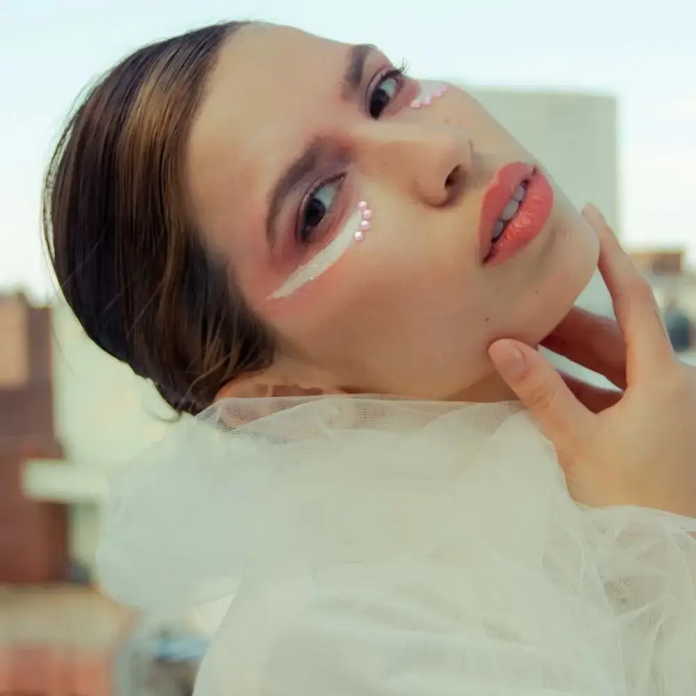 Woman showcasing the best nude eyeliner on her waterline