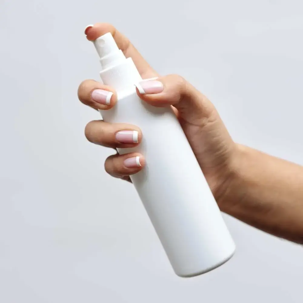 A sleek and stylish hair spray bottle