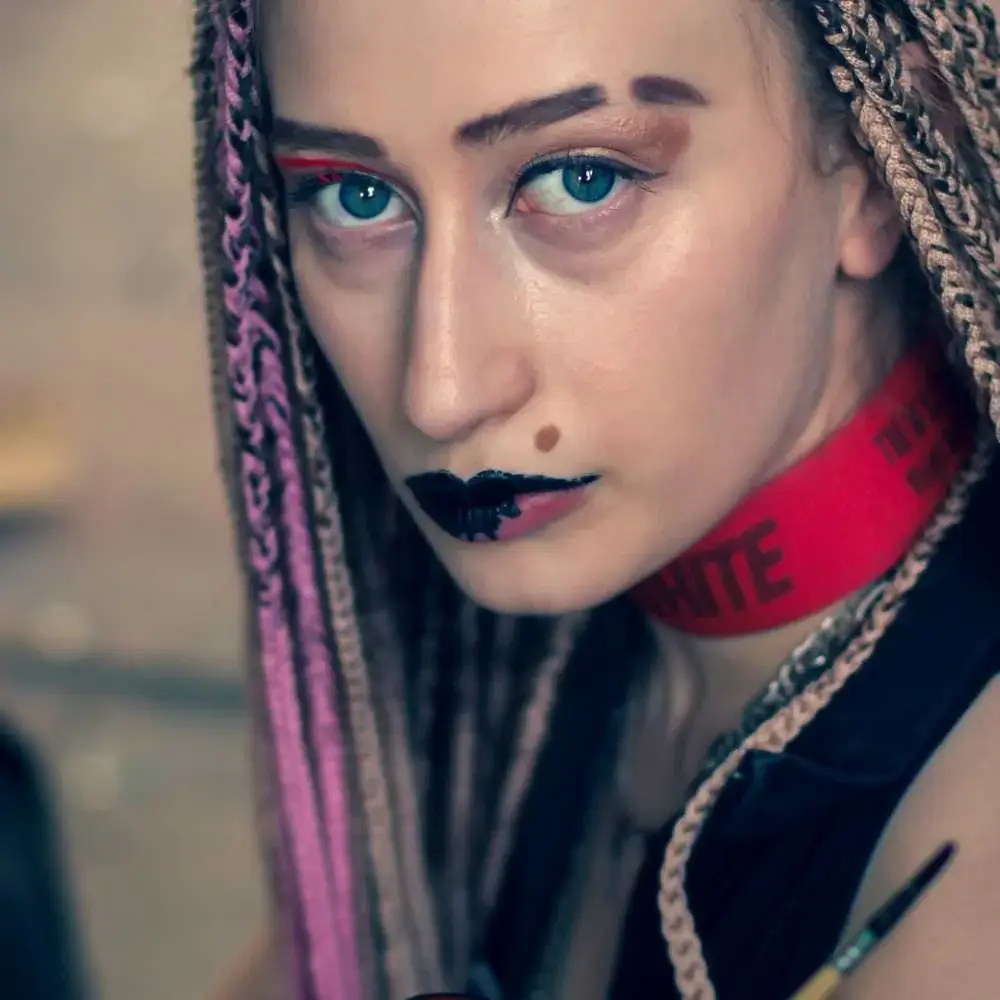 Bold, gothic-inspired look achieved using the best black liquid lipstick