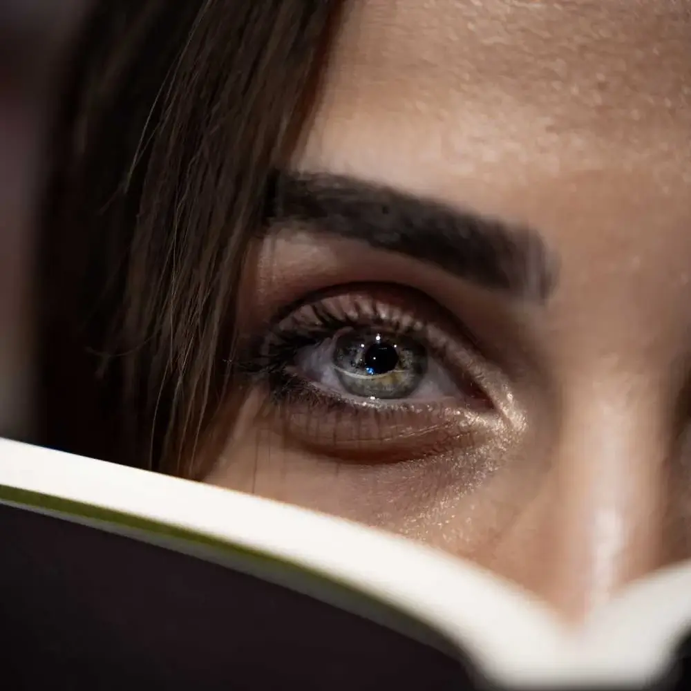 Woman showcasing her best microblading eyebrows