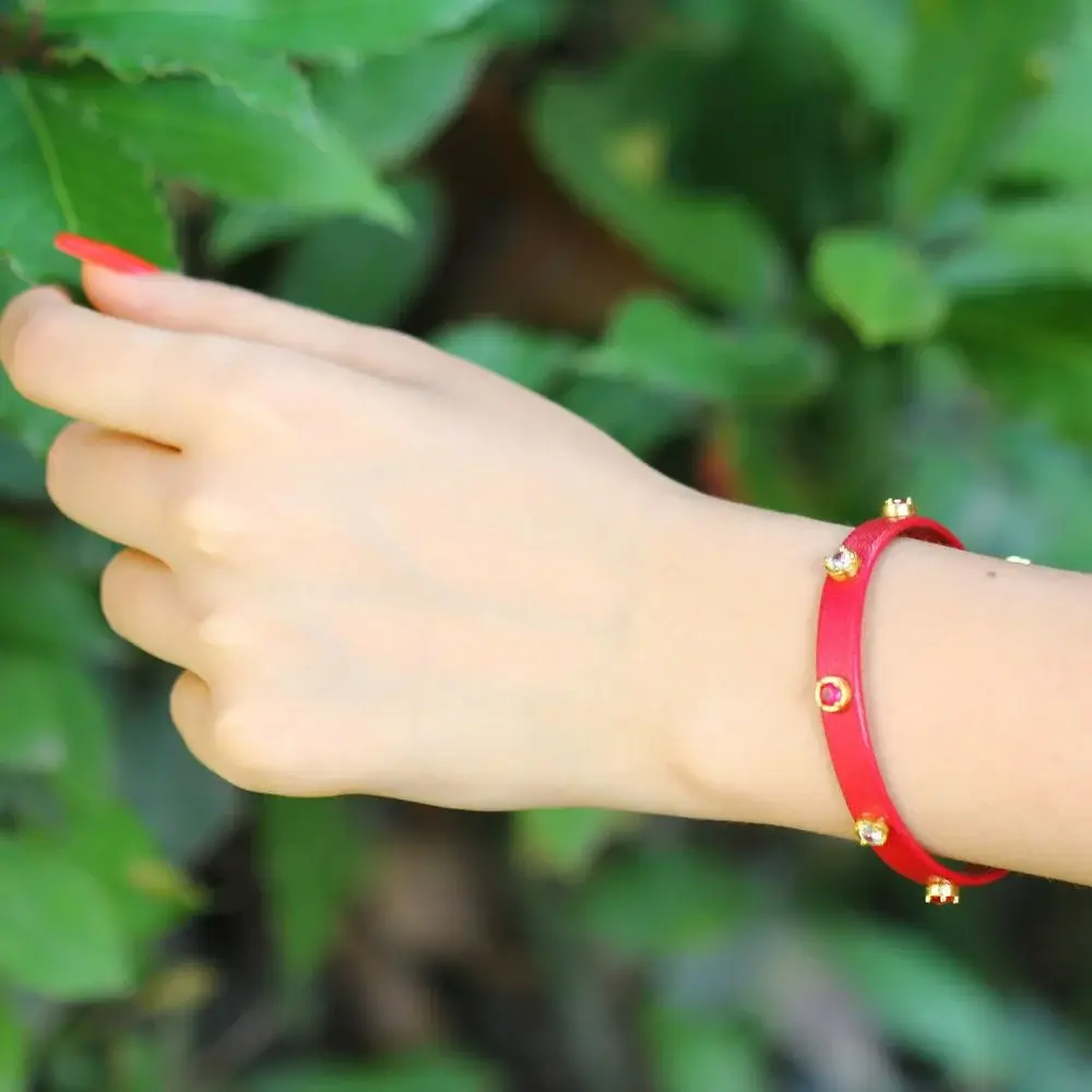 Which materials are used to create Red Evil Eye Bracelet?
