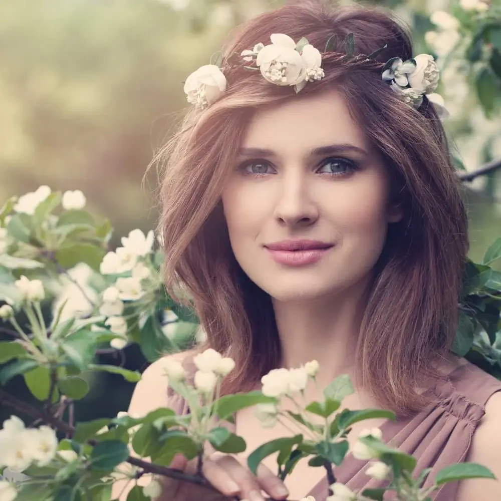 portrait of a beautiful woman wearing a floral crown