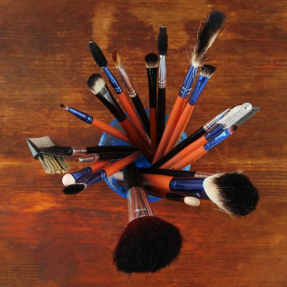makeup brushes in a glass