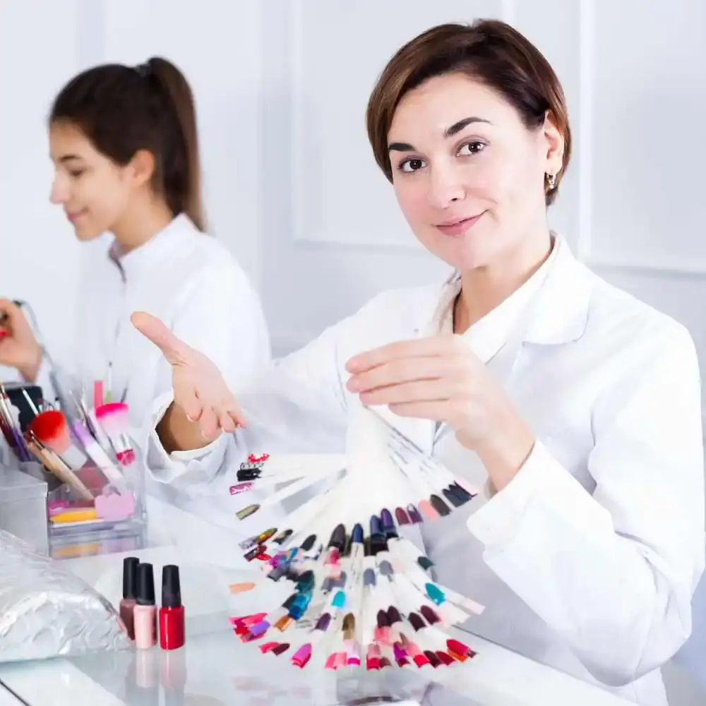 professional manicurist showing different colors of nail samples