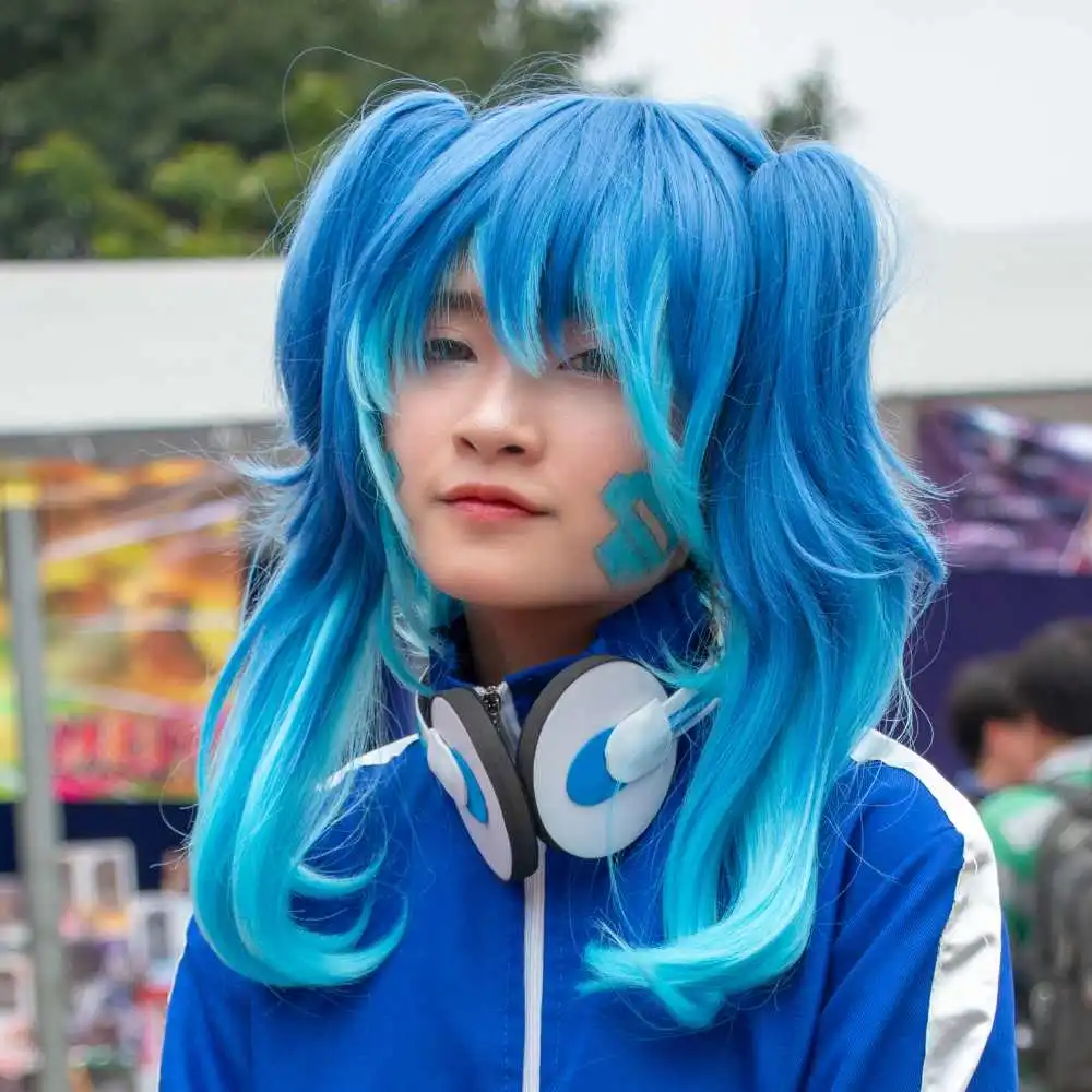 asian girl with blue stylish hair wearing a blue jacket