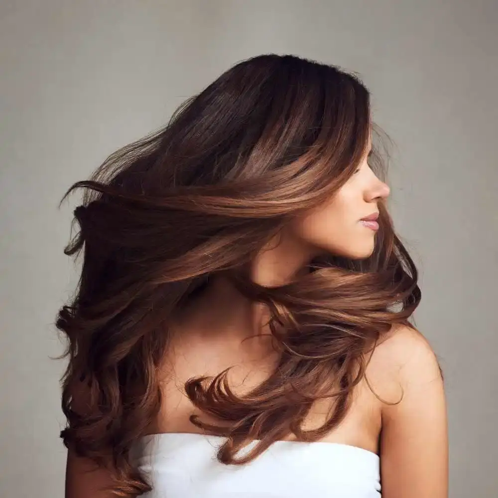 side view of a woman's portrait with long brown hair