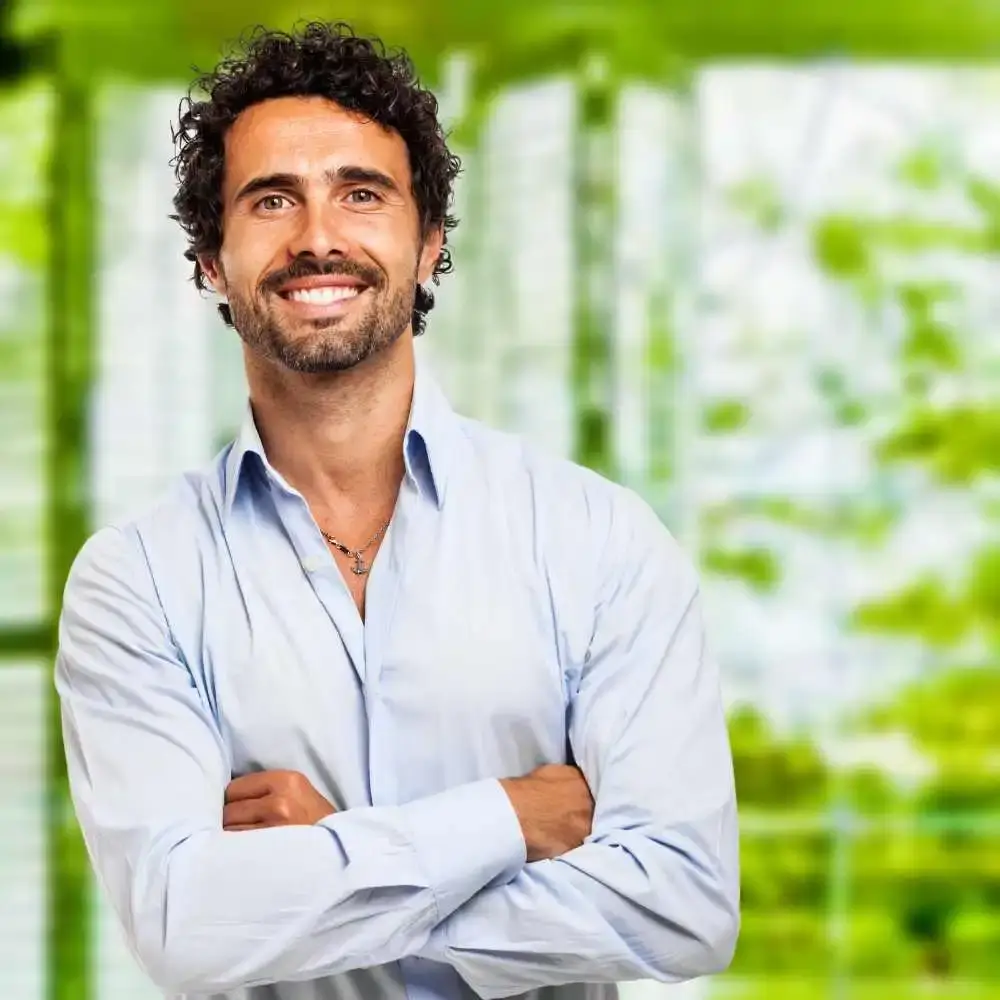 portrait of a man smiling with curly hair