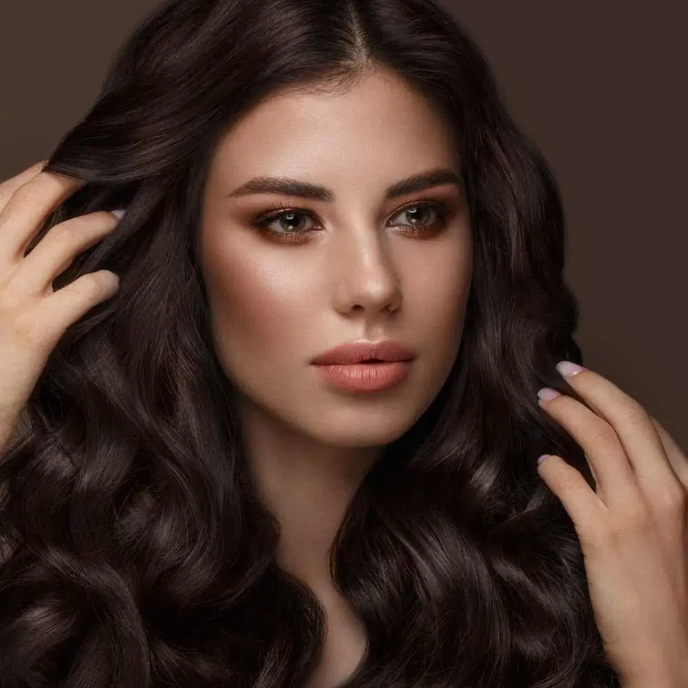 young woman with makeup and curly brunette hair