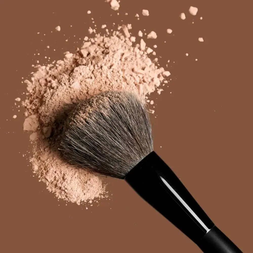 powder foundation and a makeup brush