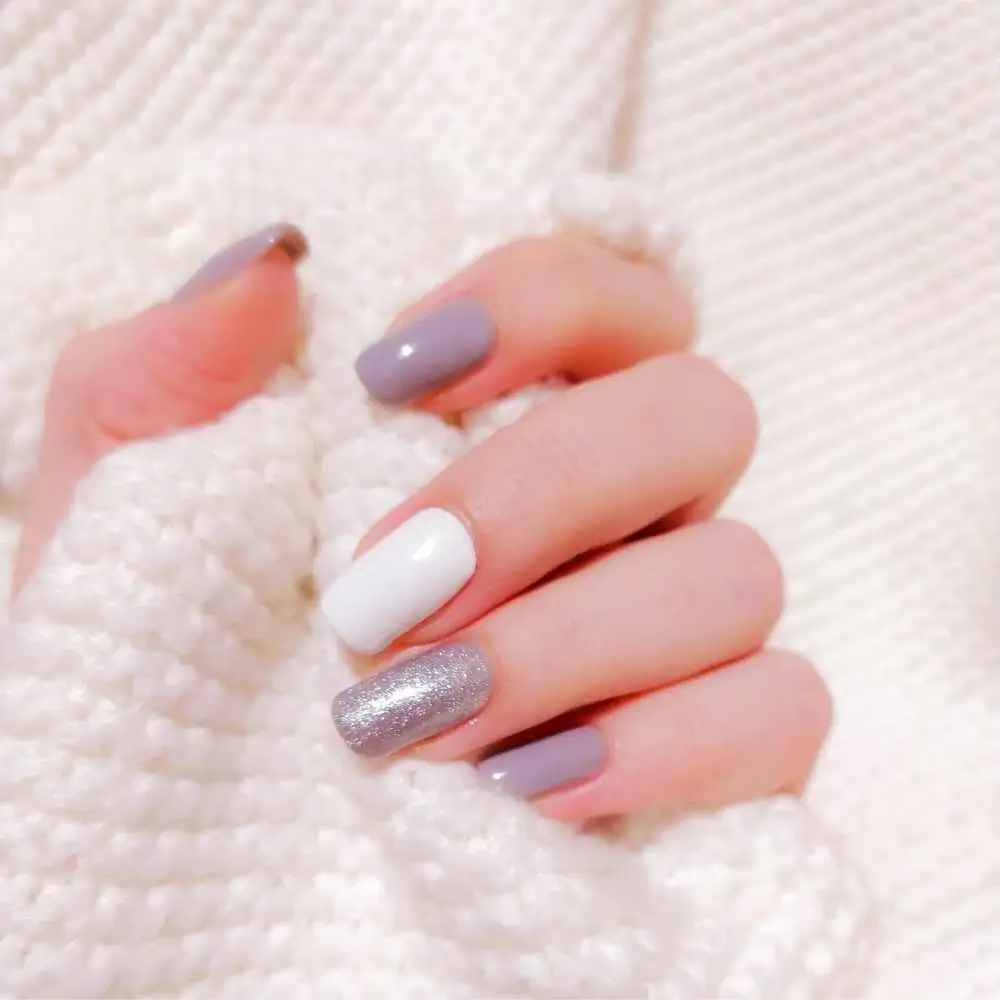 lilac nail color with white and glitter accent