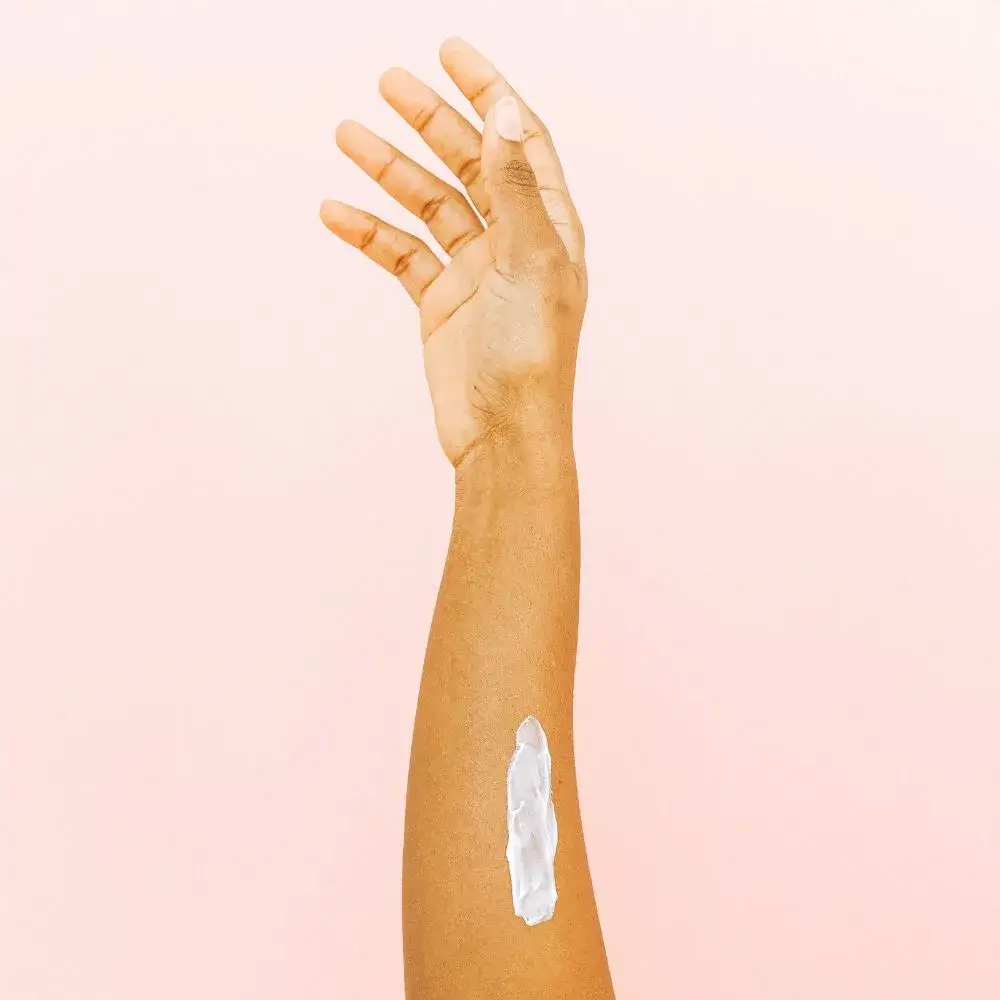 body lotion applied to hand