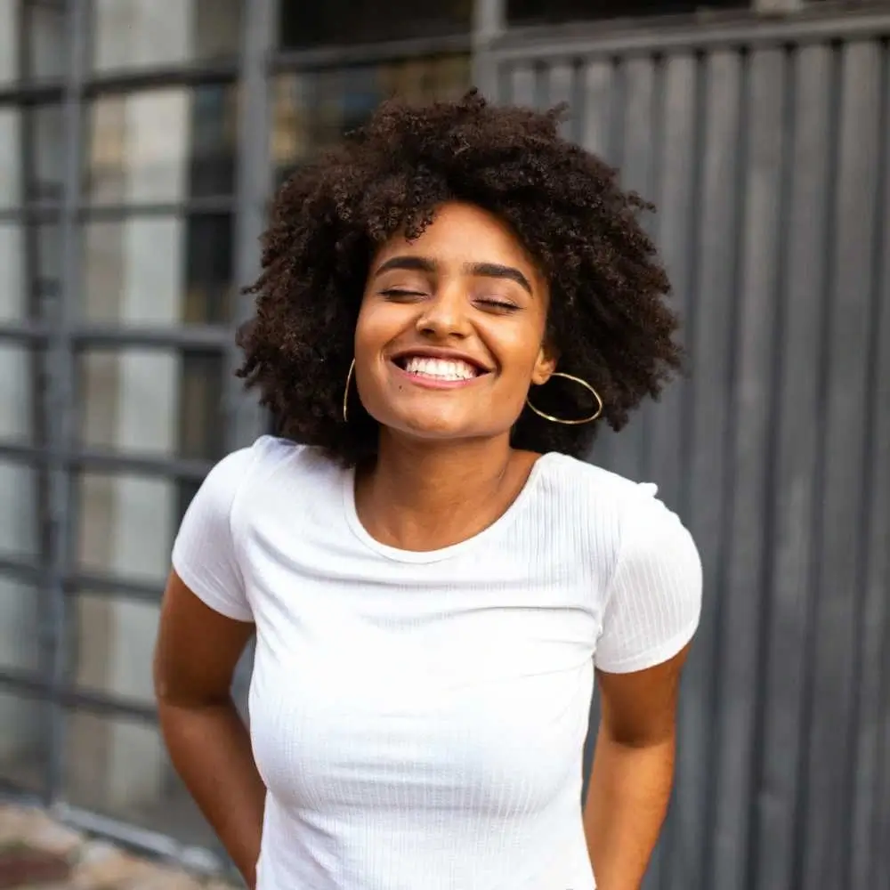 smiling woman with curly hair