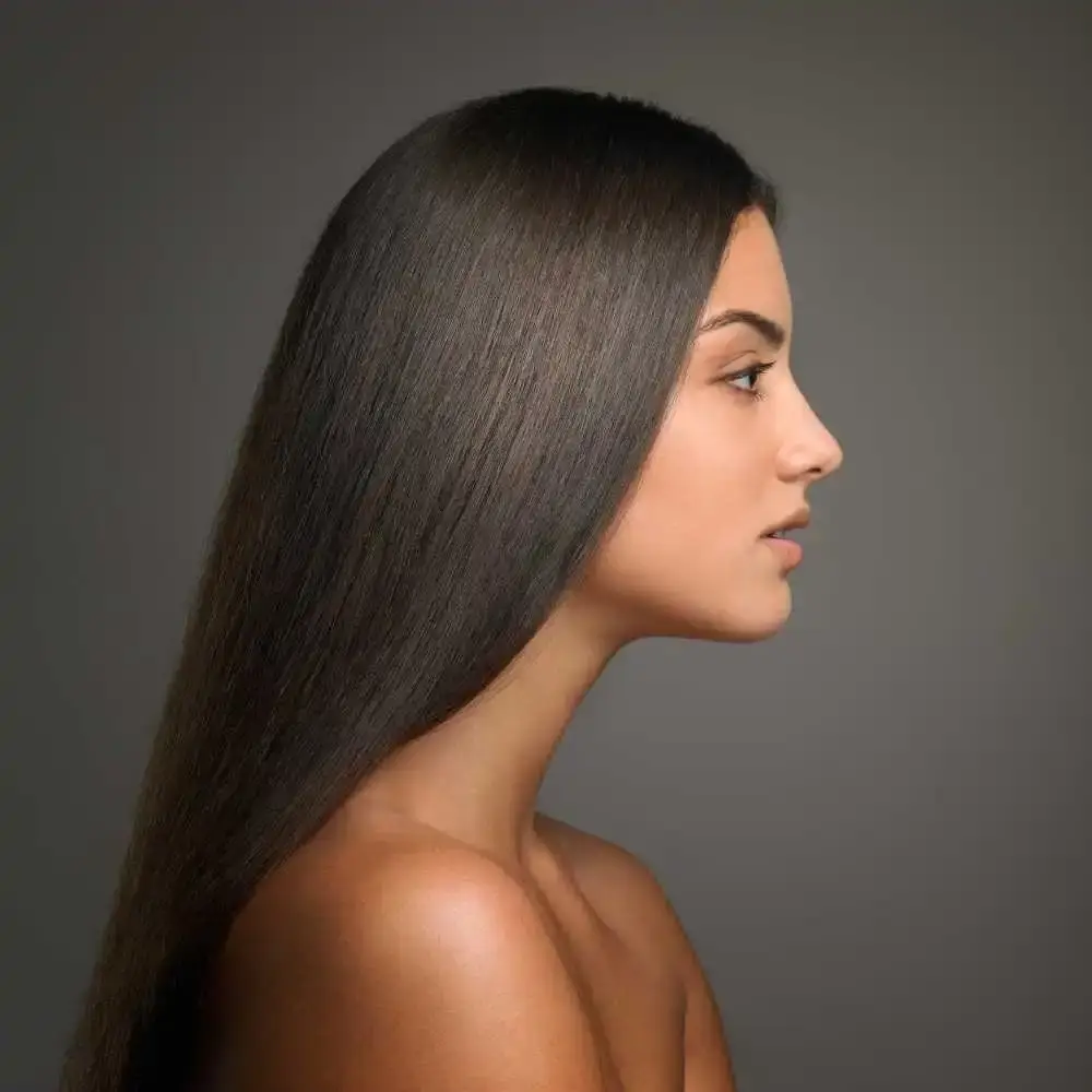 side view portrait of a woman with long straight hair