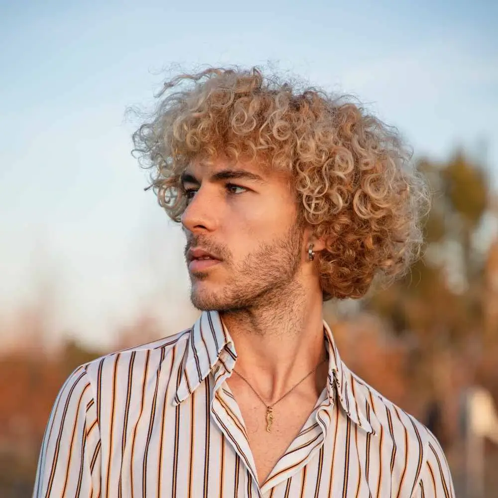 man with curly blonde hair