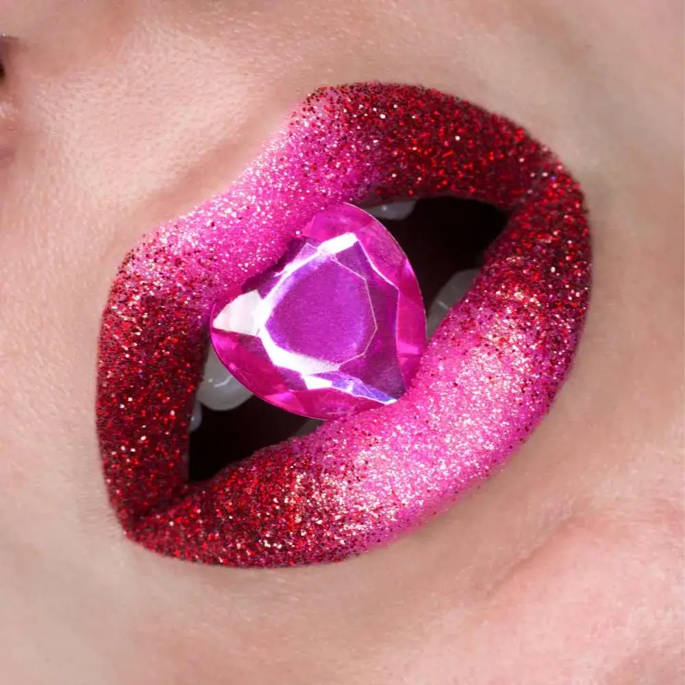 closeup view of lips in glittery red and pink lipstick