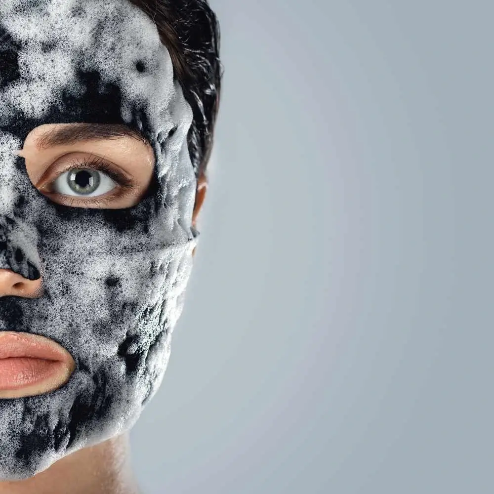 cropped close-up shot of a woman with a black face mask