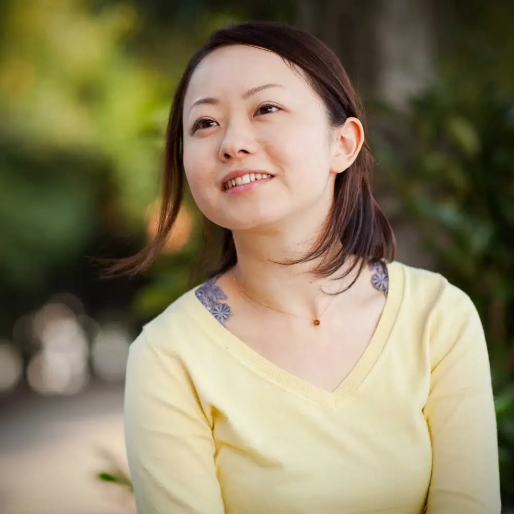 portrait of a Japanese woman wearing yellow shirt