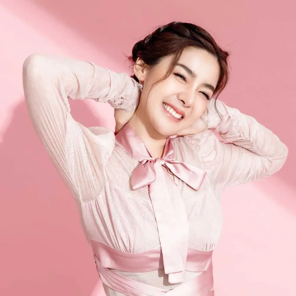 beautiful asian young woman wearing a pink dress