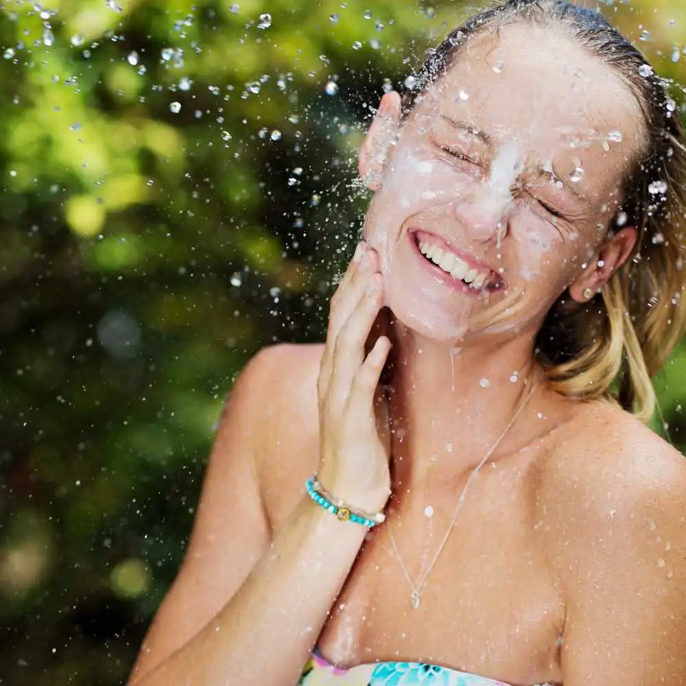 portrait of a woman's face splashed with water