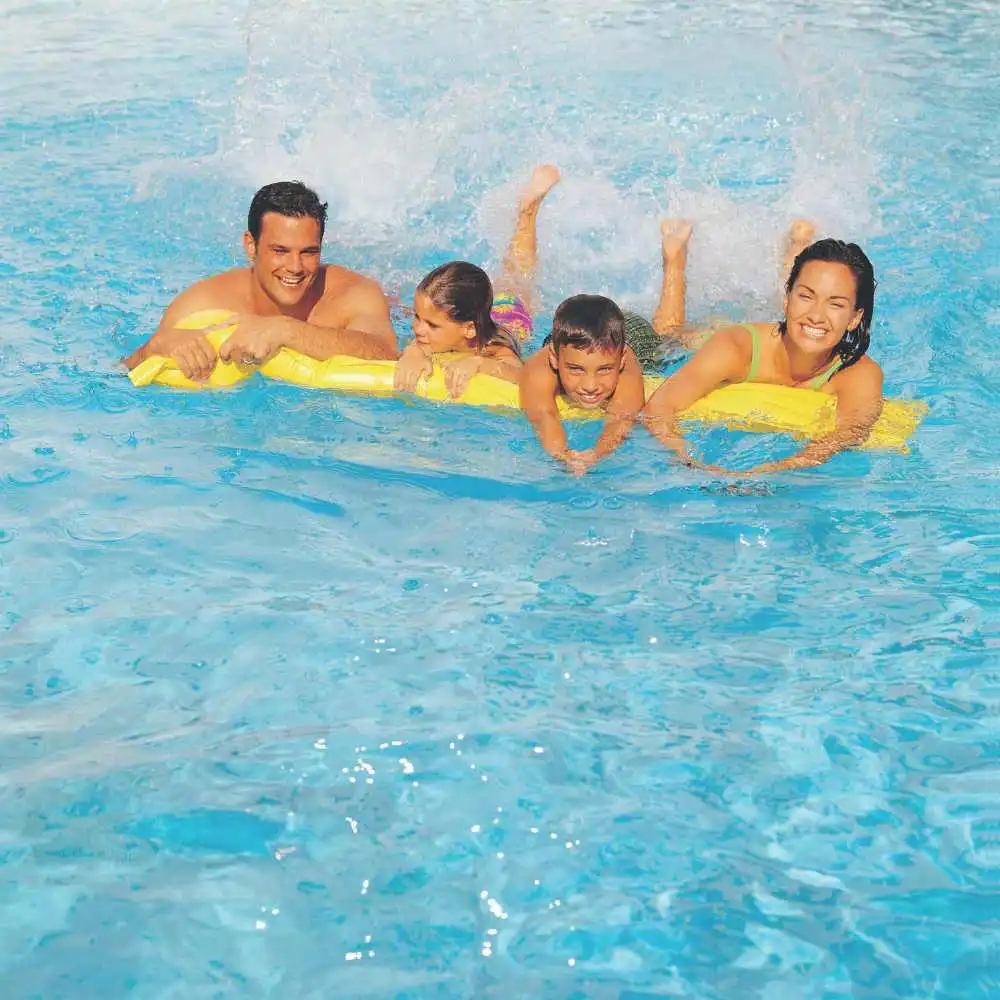 a family swimming in the pool