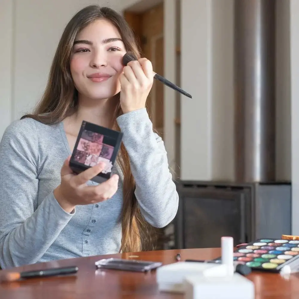 Powder blush giving a pop of color to fair skin