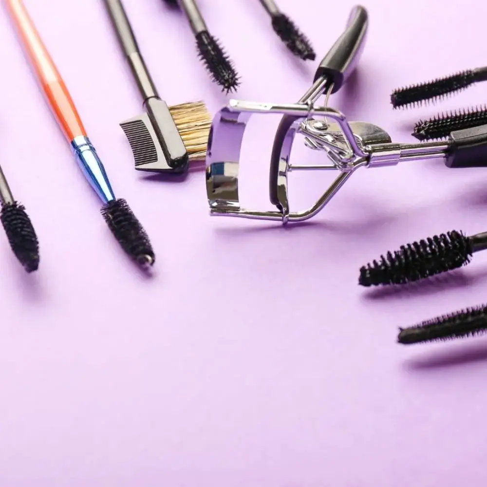 Close-up of a clear eyebrow gel applicator and formula