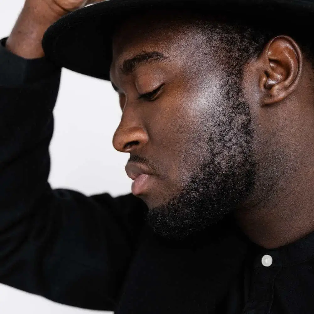 Man looking confident after using the best beard oil for black men