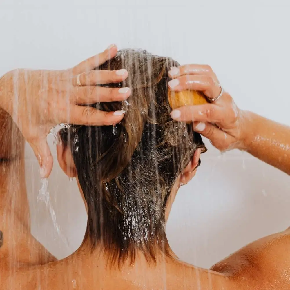washing the hair with shampoo bar
