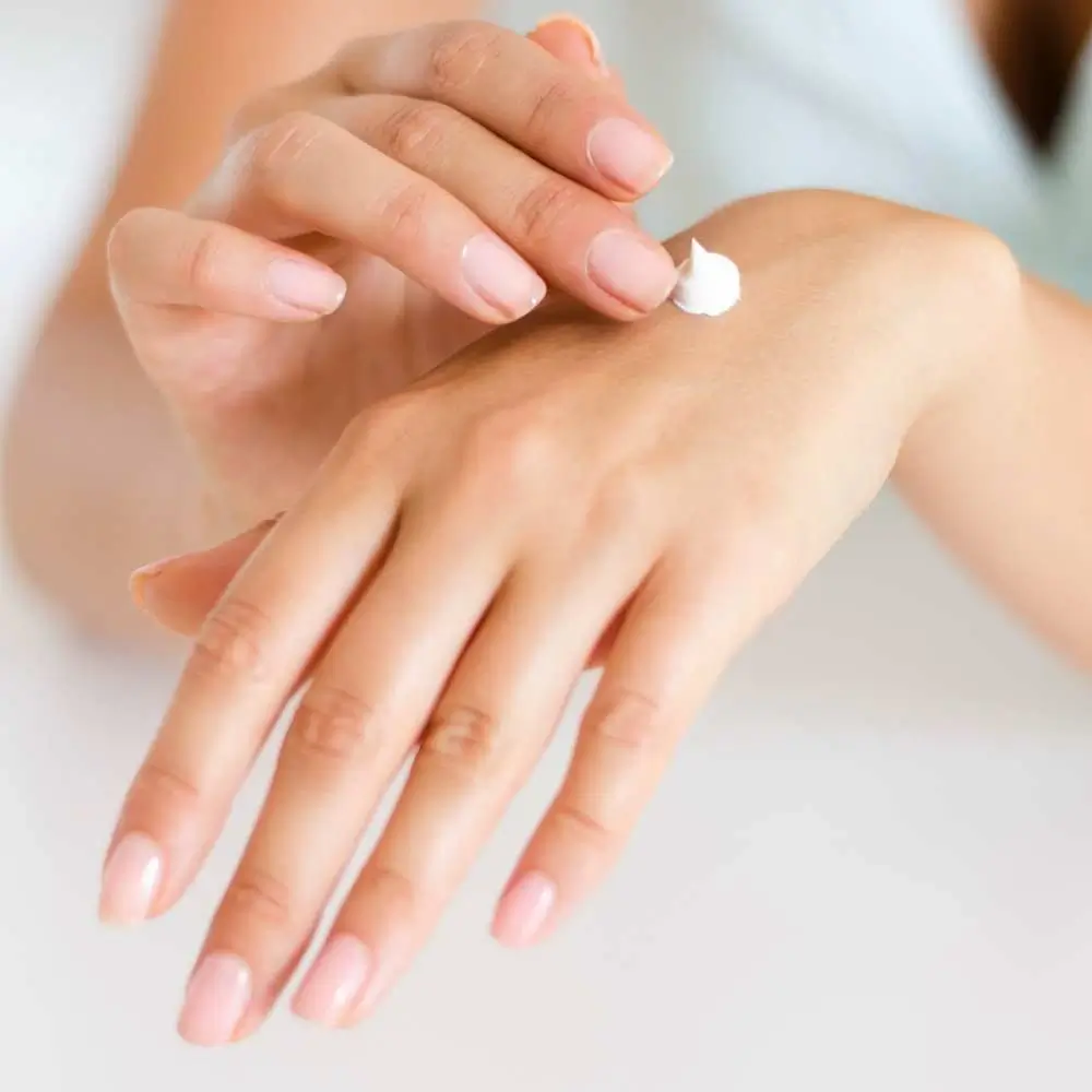 applying small amount of lotion on hand