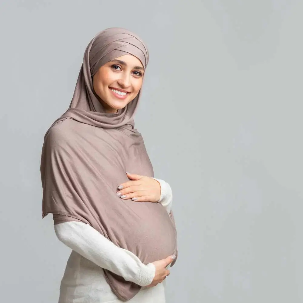 woman posing while holding her belly