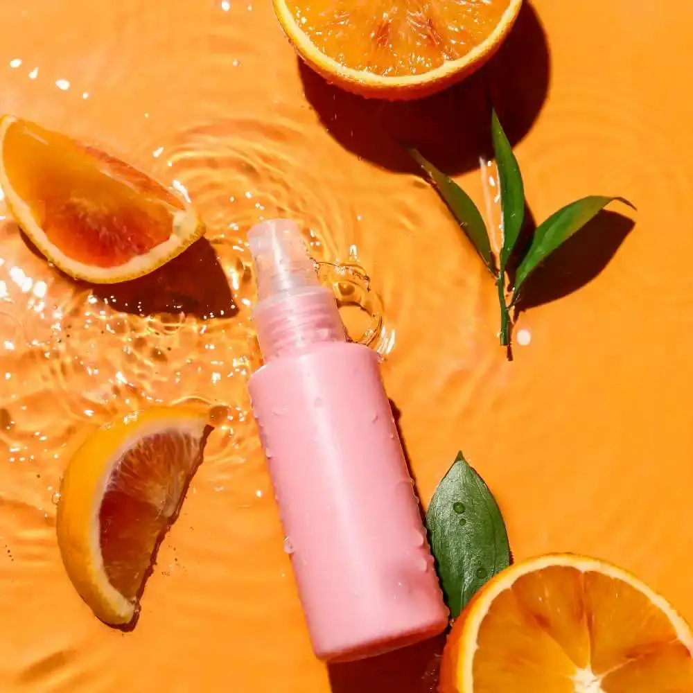 vitamin C face wash bottle with sliced oranges
