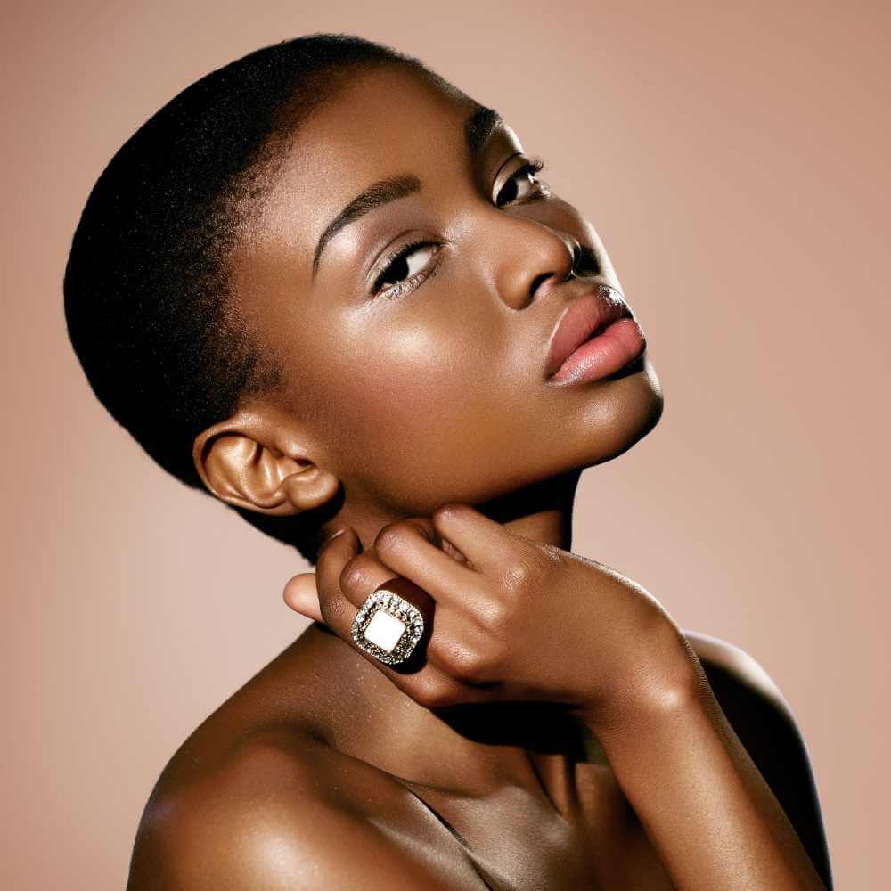 black woman with healthy glowing skin wearing a ring