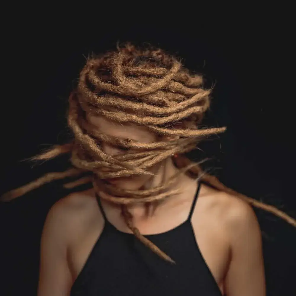 Person with healthy, clean dreadlocks achieved with the right shampoo choice