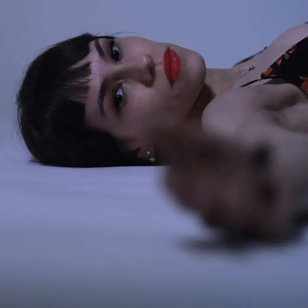 Asian woman confidently flaunting her red lipstick