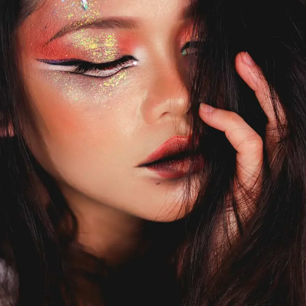 Close-up of dazzling glitter lipstick on a woman's lips