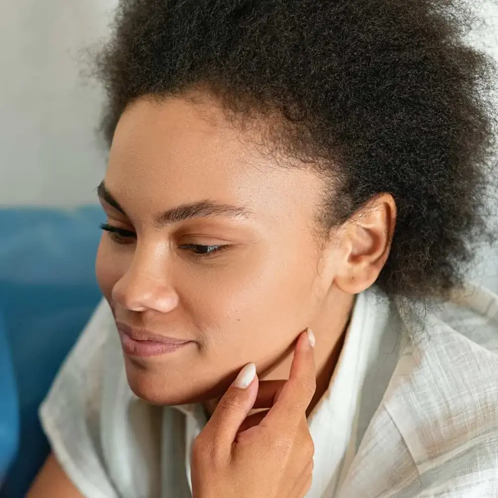 application of edge control for a sleek hairstyle