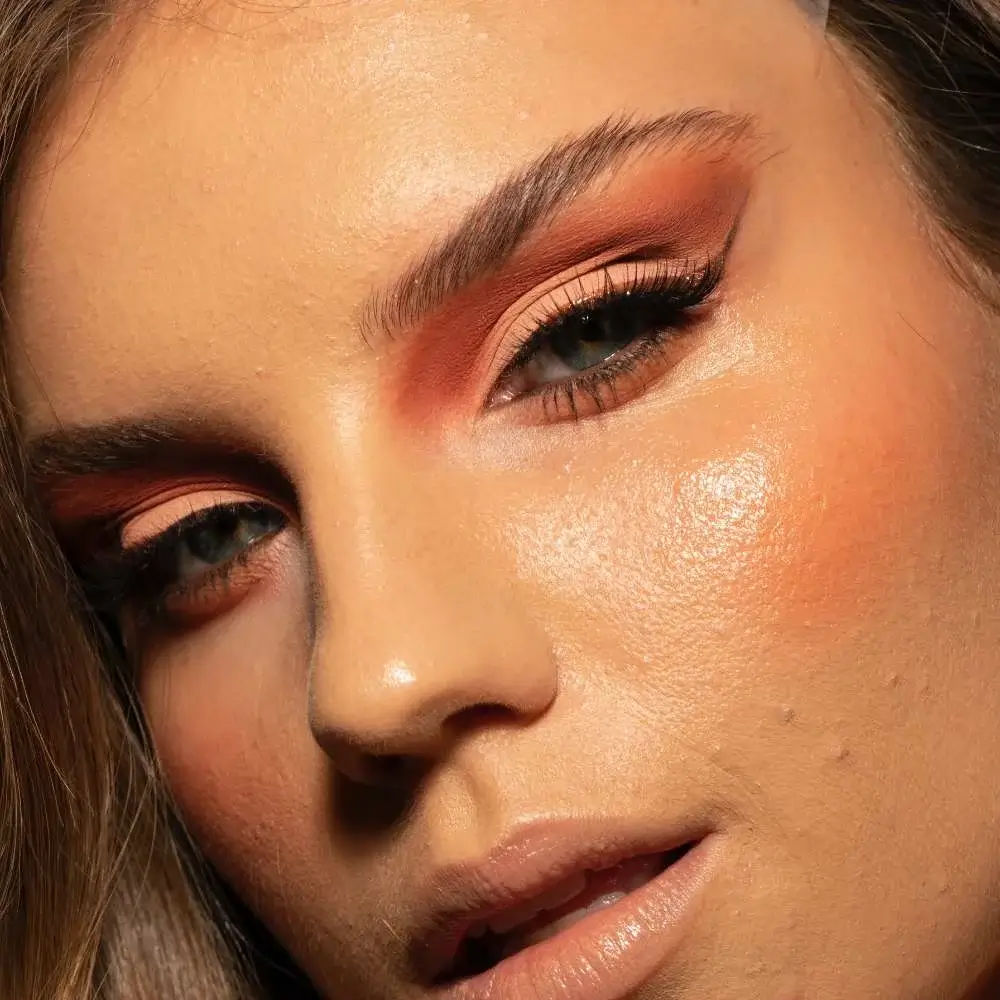  applying bronzer for a sun-kissed glow