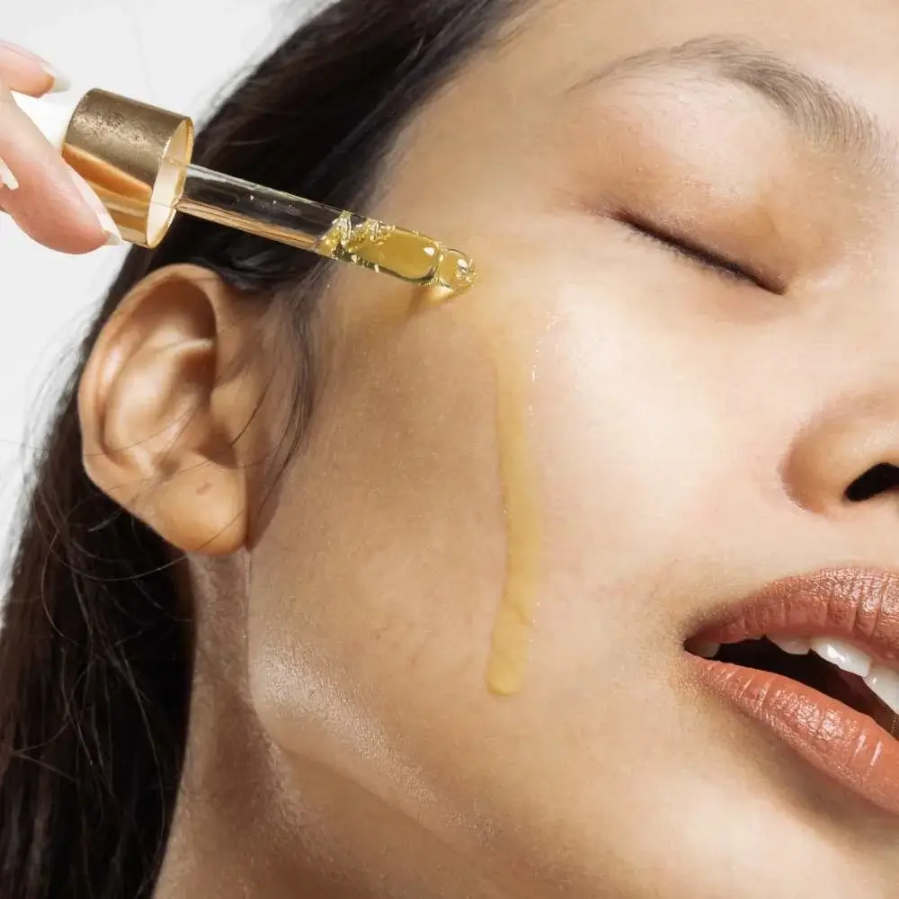 Applying acne-fighting Korean face serum