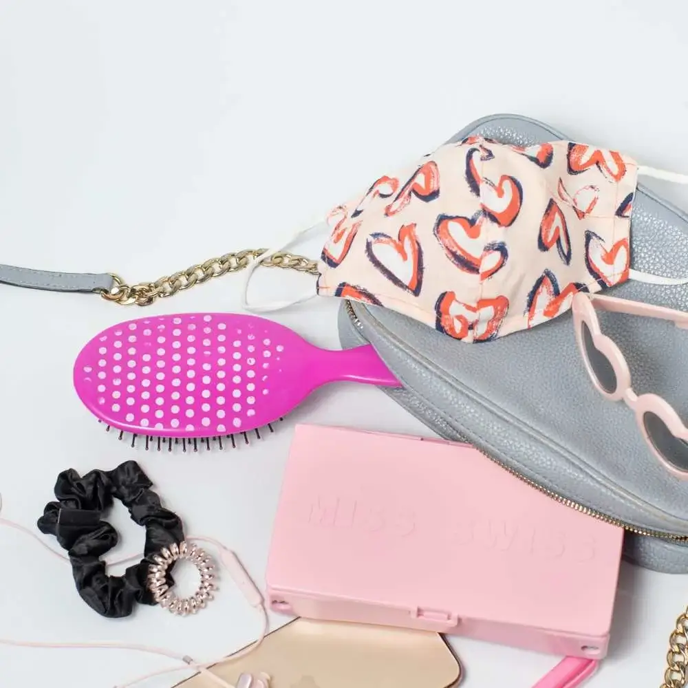 A foldable travel hair brush perfect for on-the-go touch-ups
