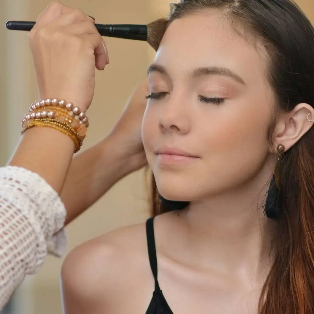 A professional makeup artist applying foundation flawlessly