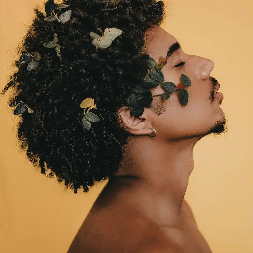 Man after using leave-in conditioner to his hair for a healthy shine