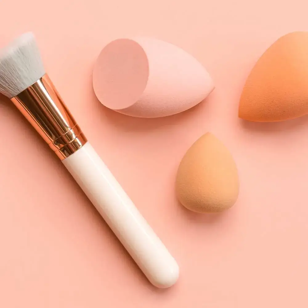 Close-up of a handful of colorful makeup sponges