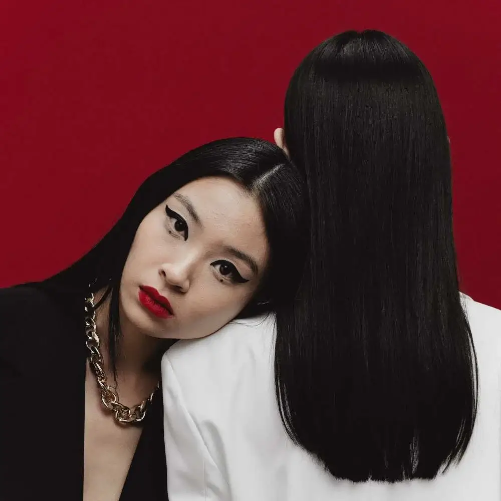 Asian woman elegantly wearing bold red lipstick