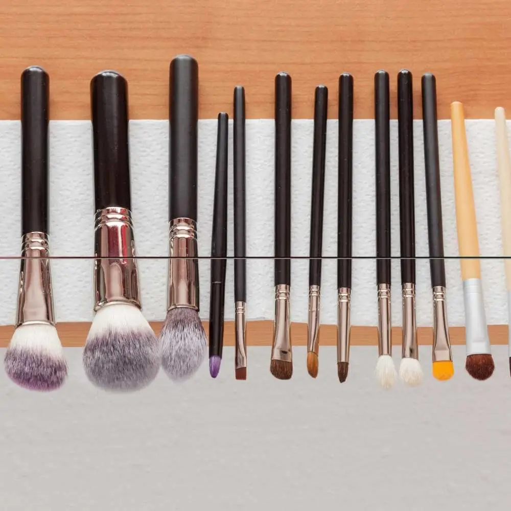 Makeup brush drying on a towel after cleaning