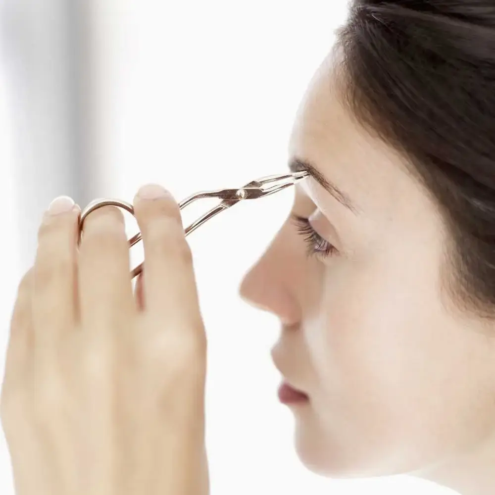 At-home grooming - trimming eyebrows with scissors