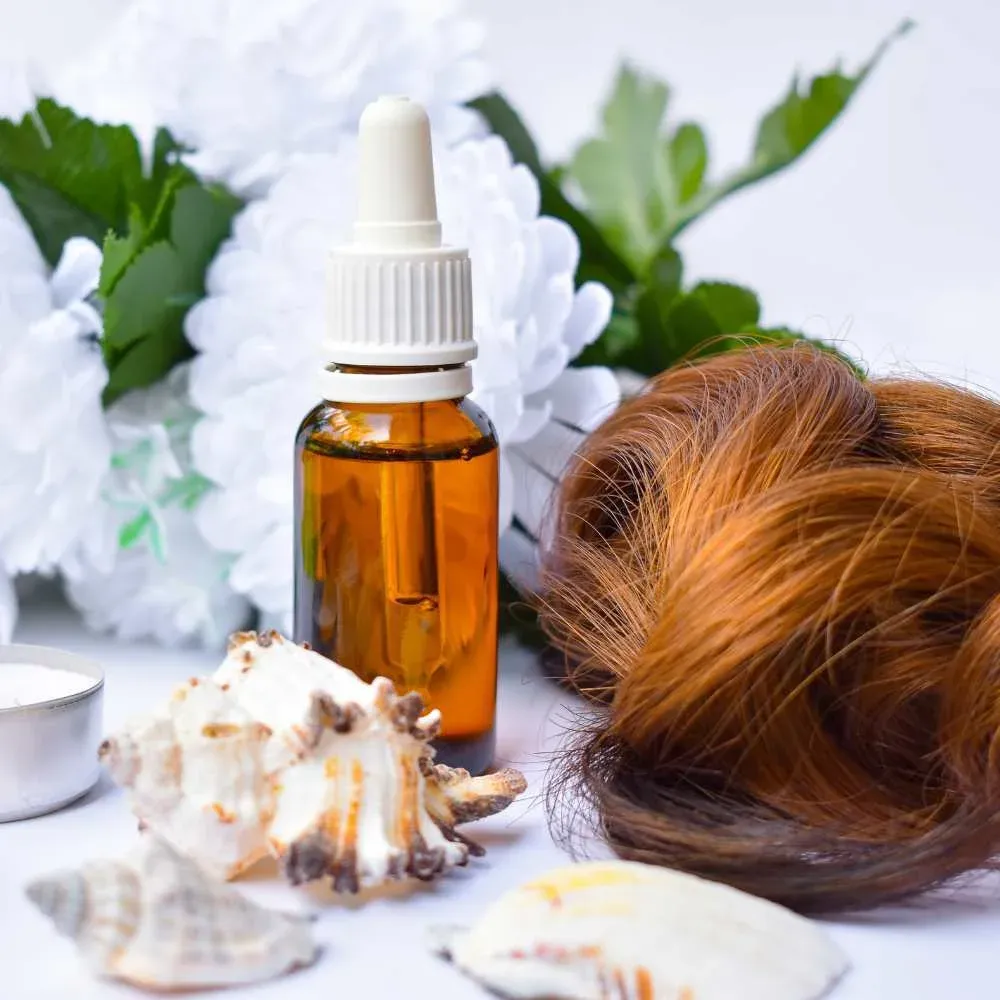 Pure Argan Oil in a glass bottle on a wooden table