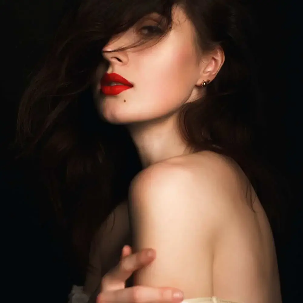 Woman wearing her favorite shade of cruelty-free lipstick