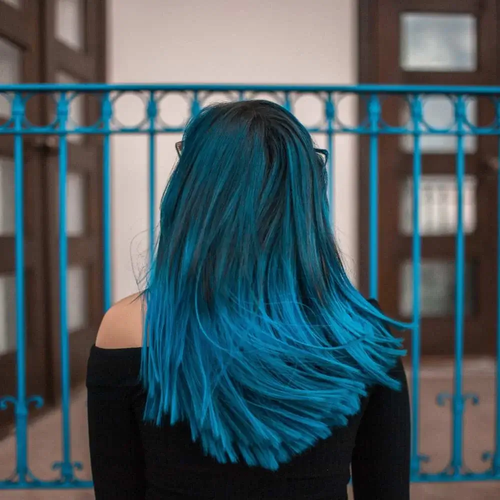 blue shampoo to neutralize orange tones in her hair